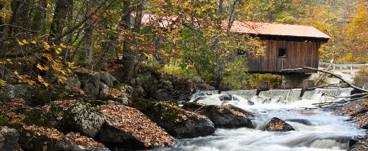 small hut looking over the river with rocks and trees relates sites